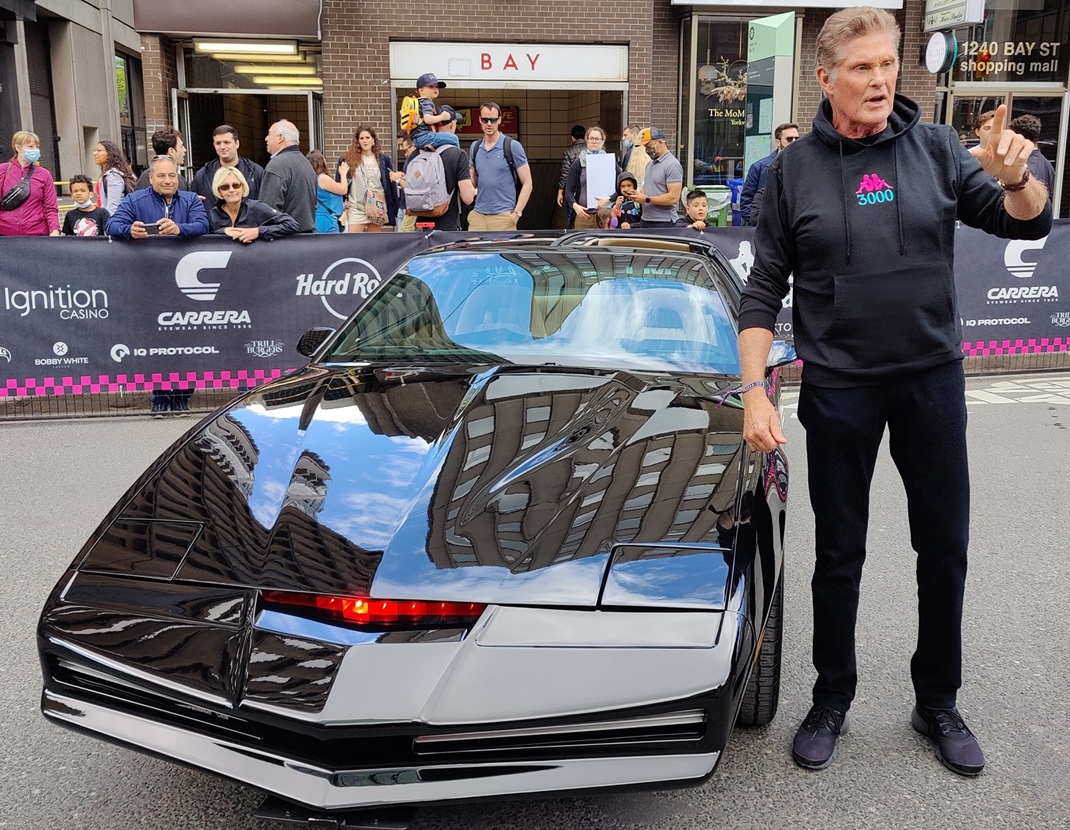 David Hasselhoff posing next to the AGI KITT - KITT FOR HIRE Knight Rider replica car on Bay Street in Toronto during the Gumball 3000 rally from Toronto to Miami