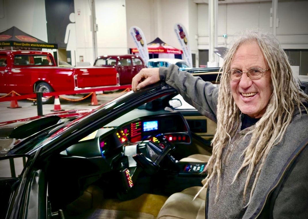Mike Hall from Rust Valley Restaurations sitting inside the cockpit of the AGI KITT replica car at the Motorama Custom Car Show in Toronto