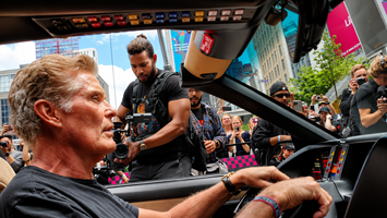 Camera crew filming David Hasselhoff inside the cockpit of KITT during a Toronto event