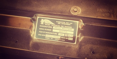 Close-up detail of the custom Knight Industries manufacturer plate inside the KITT replica car