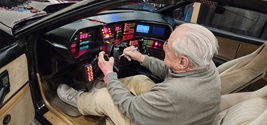 William Daniels signing the steering wheel of KITT